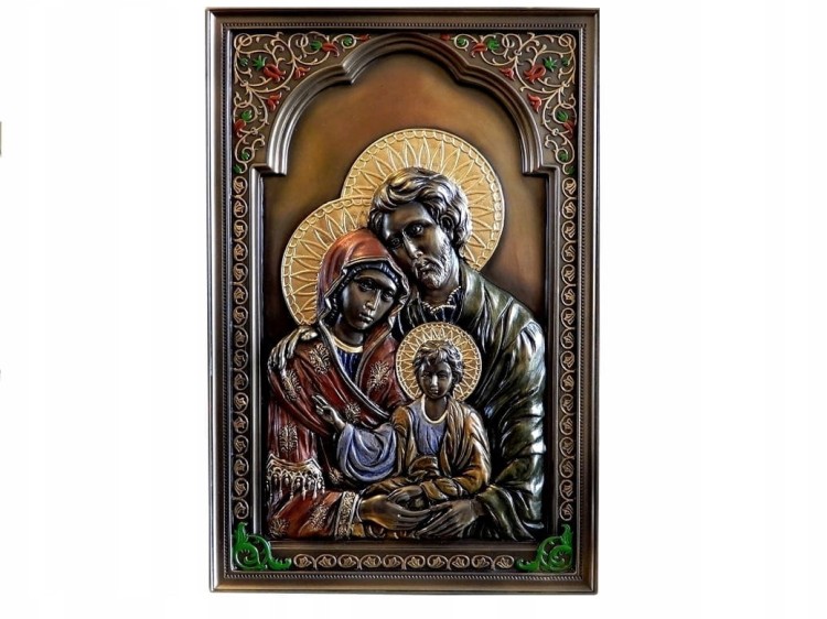 Religijna płaskorzeźba Świętej Rodziny w ozdobnej, metalizowanej ramie.
