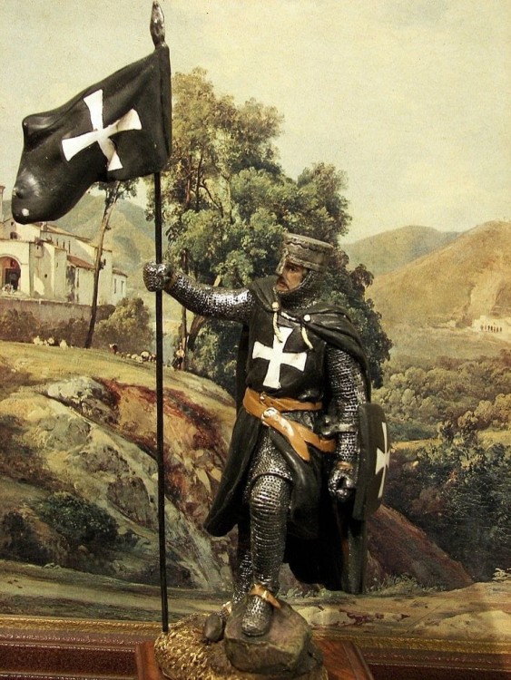 rycerz w zbroi ze sztandarem